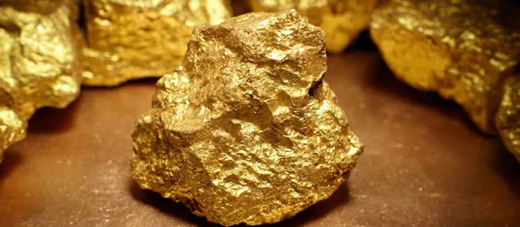 Which civilization is believed to have been the first to use gold for currency?