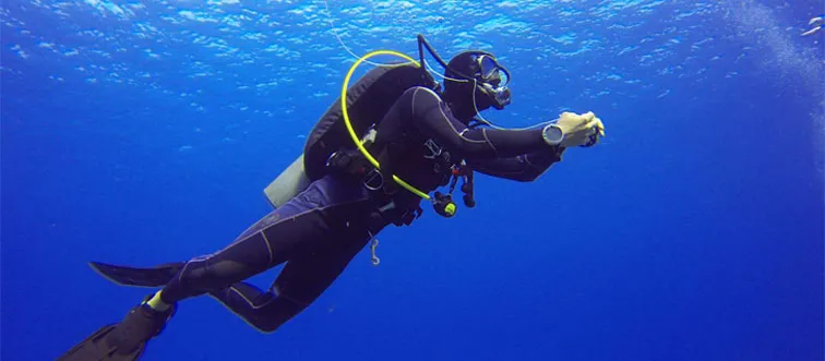 What is the maximum depth a human can safely dive without special equipment?