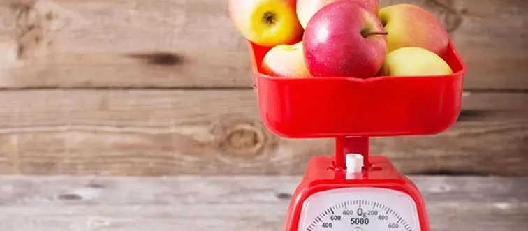 Which weighs more? A ton of apples or a ton of feathers?